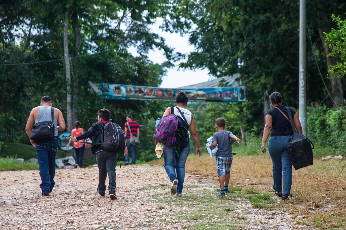 Guatemala. Refugees arrive at the Mexican border