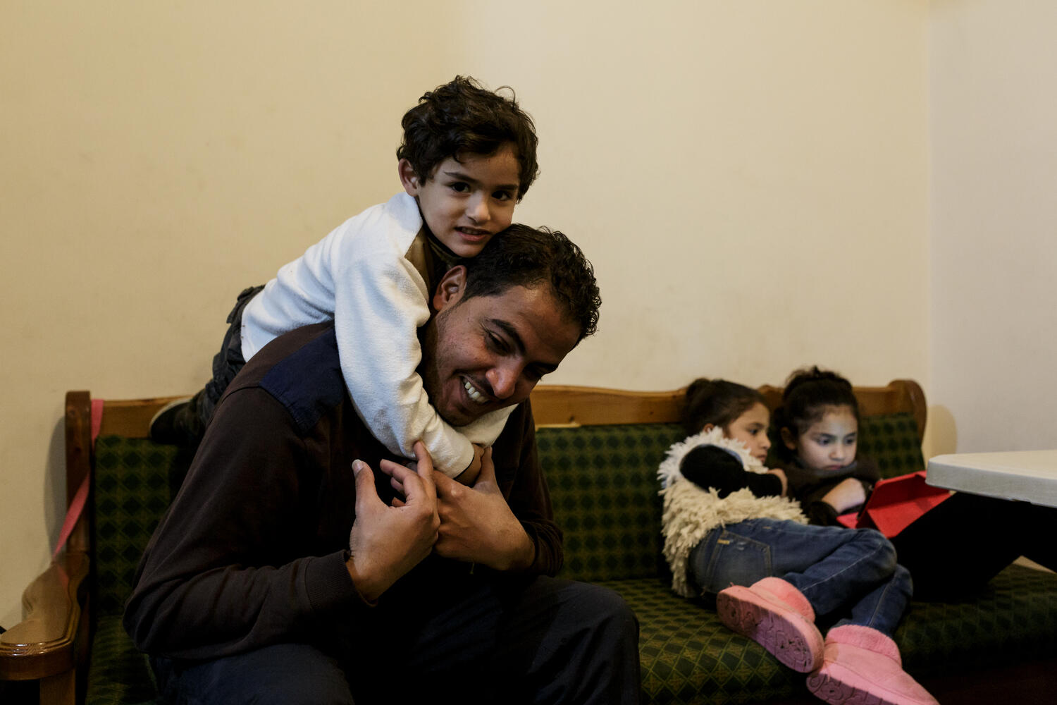 Greece. The Syrian electrician installing power at Lesbos refugee camp