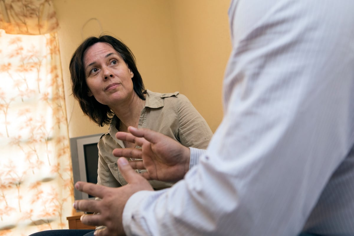 Spain. Pakistani refugee talks with his Spanish mentor