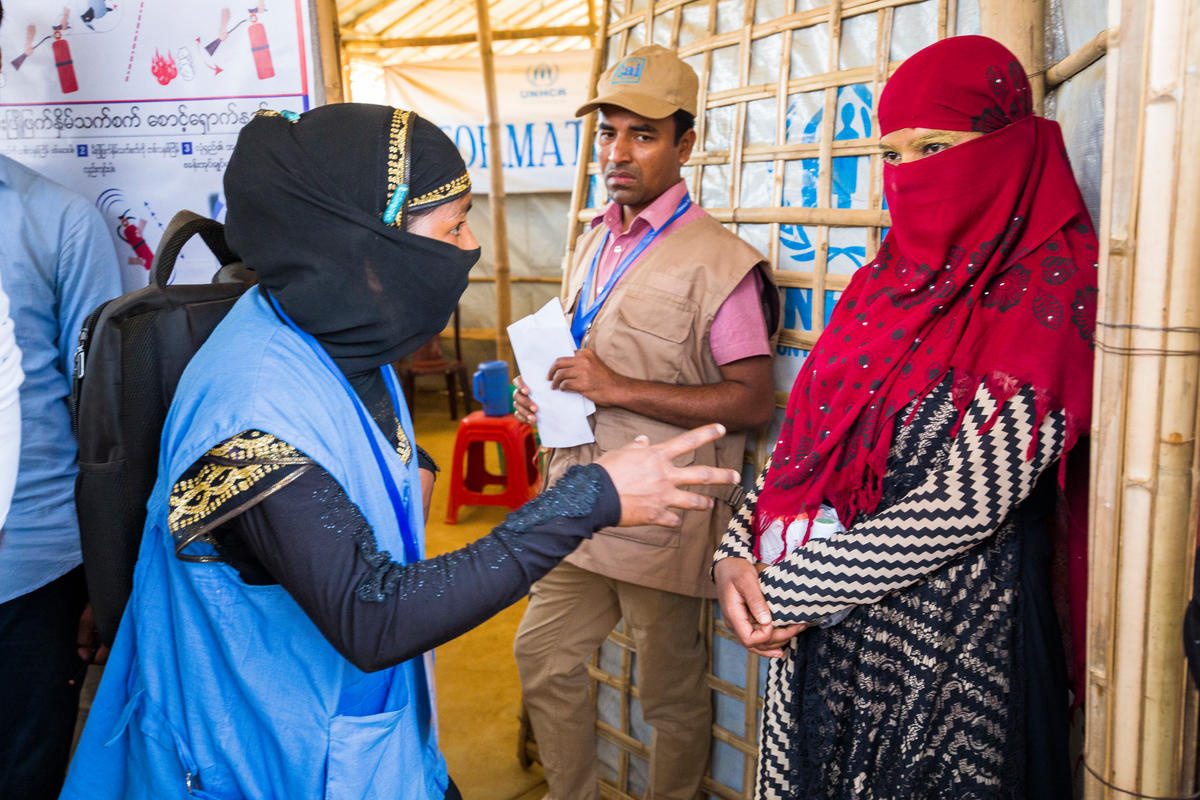 Bangladesh. Female head of households recieve assistance from Community Outreach Volunteers