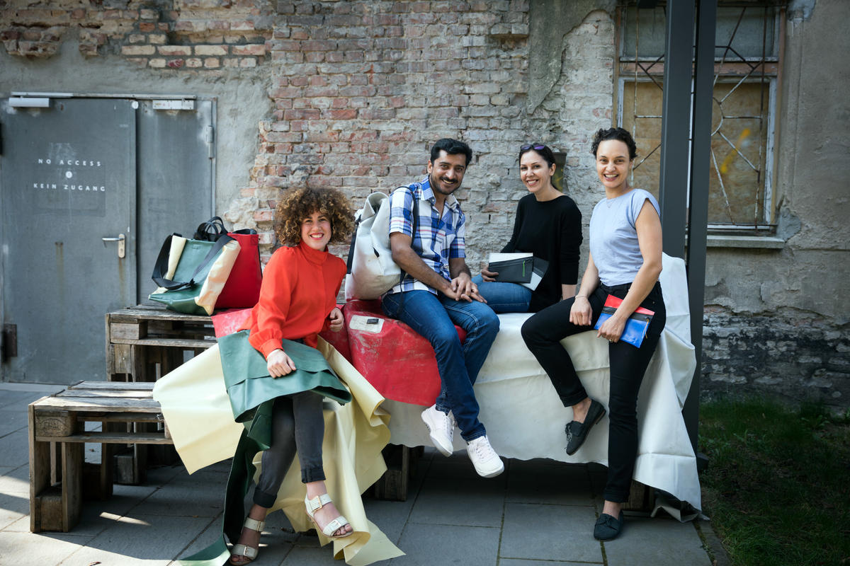 Germany. A non-profit initiative is employing newcomers to upcycle broken refugee boats into thought-provoking products.