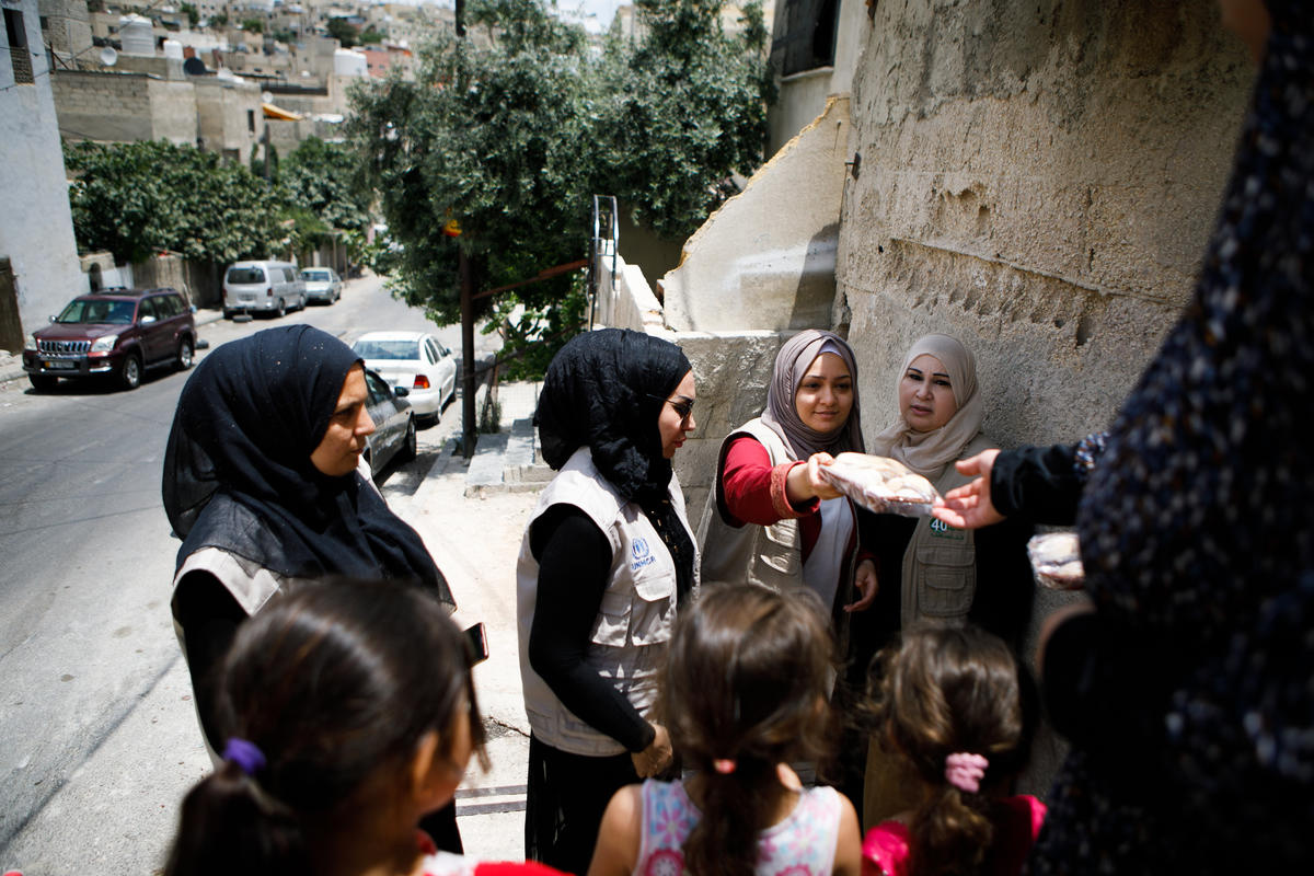 Jordan. A group of refugee women make sweets for Eid and distribute to needy families