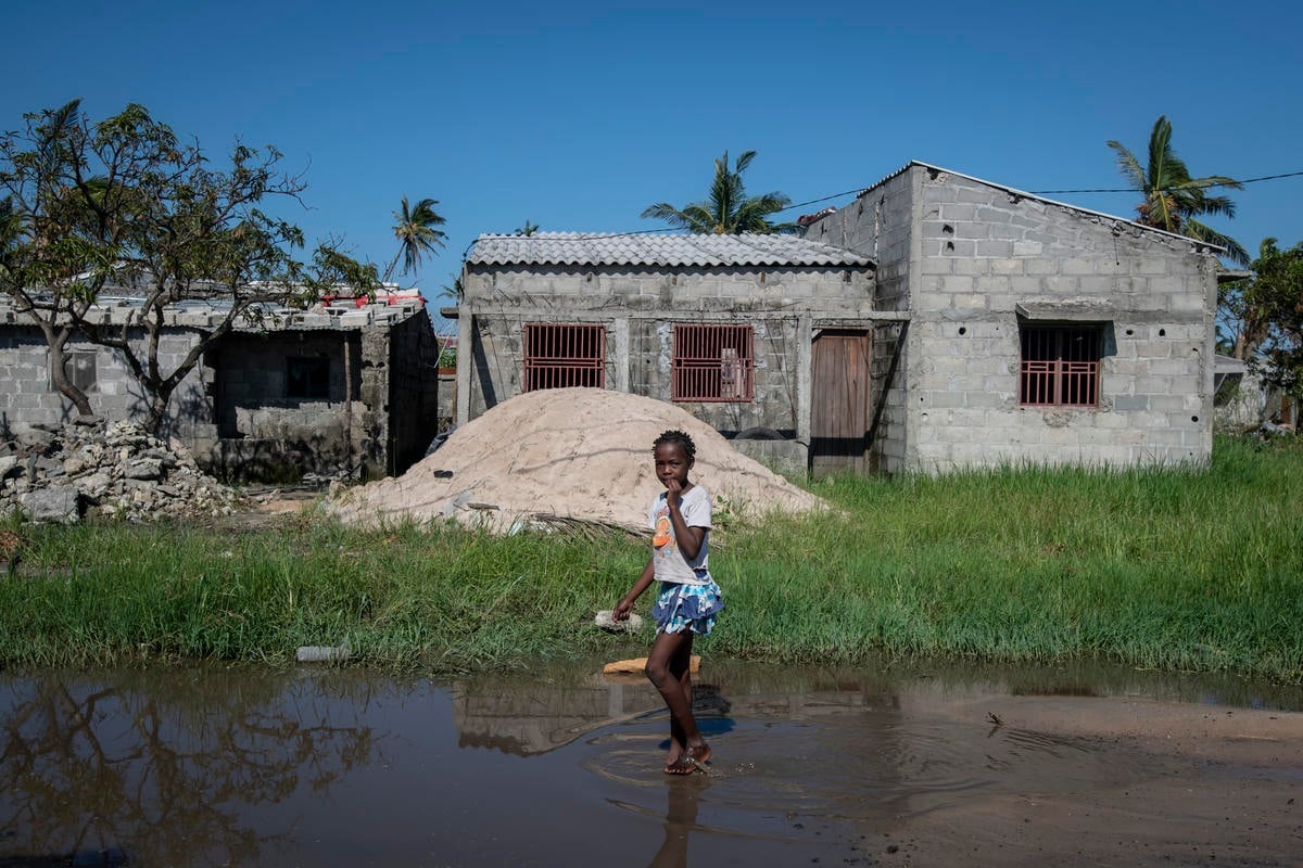 Mozambique. A girl walks through flood waters
