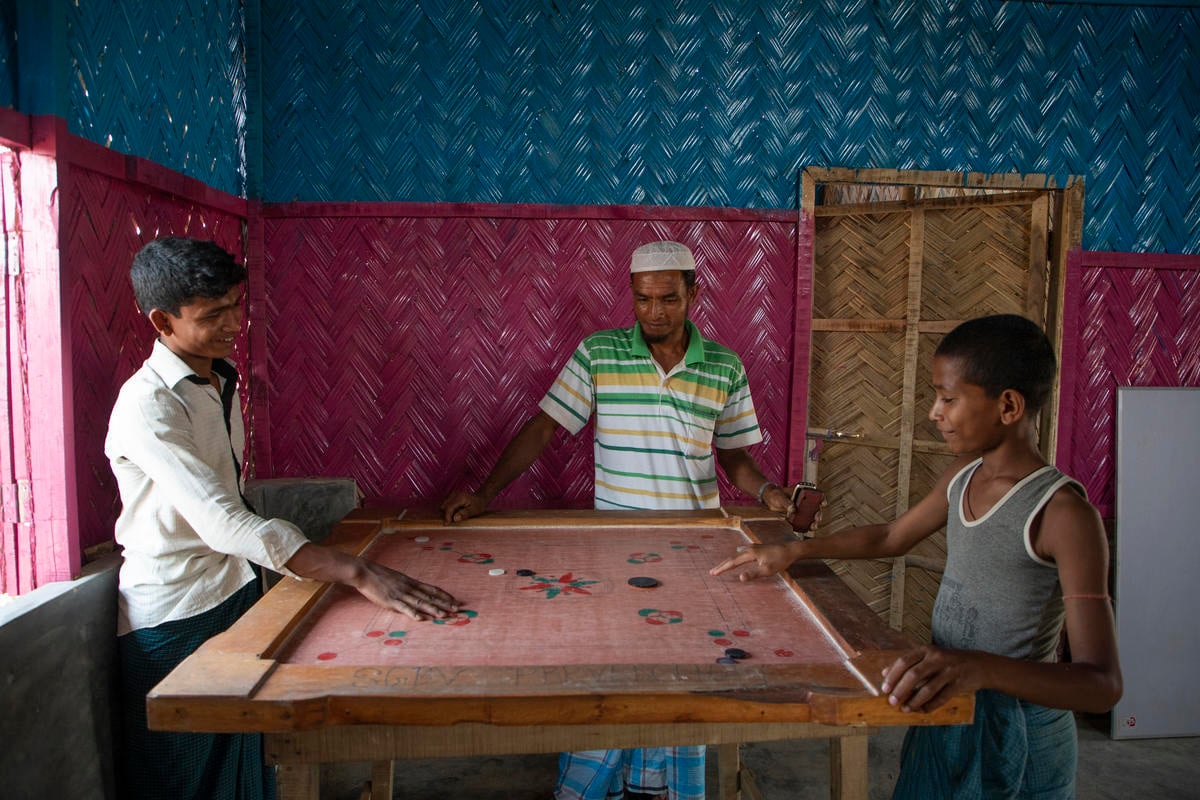 Bangladesh. Young Rohingya Refugees   play carrom, a South Asian board game.