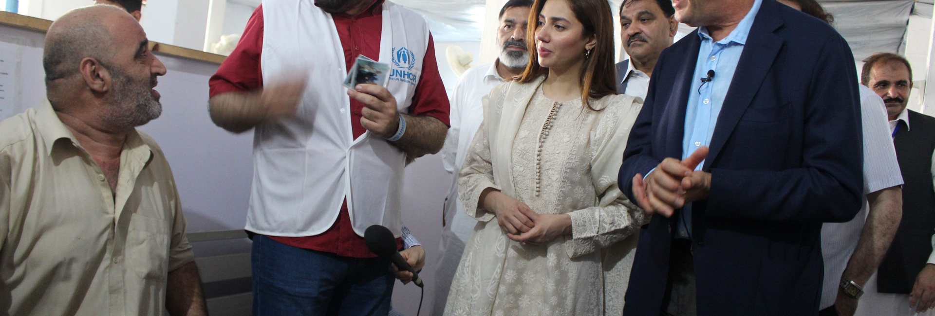 Pakistan. Goodwill Ambassador, Mahira Khan, observes as Afghan refugees go through resettlement process. 