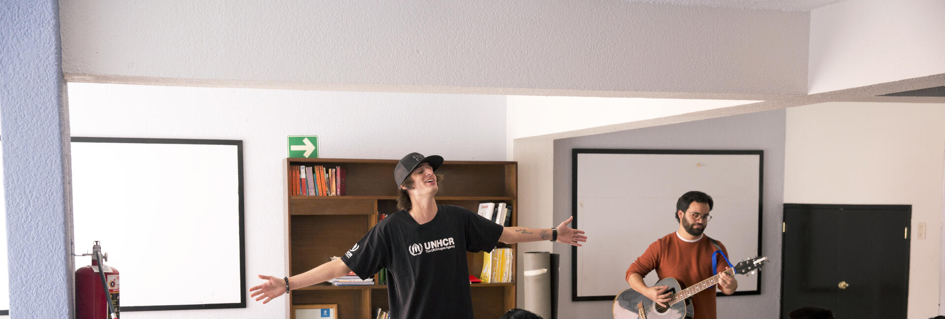 Danny Ocean performing for the kids at the shelter.