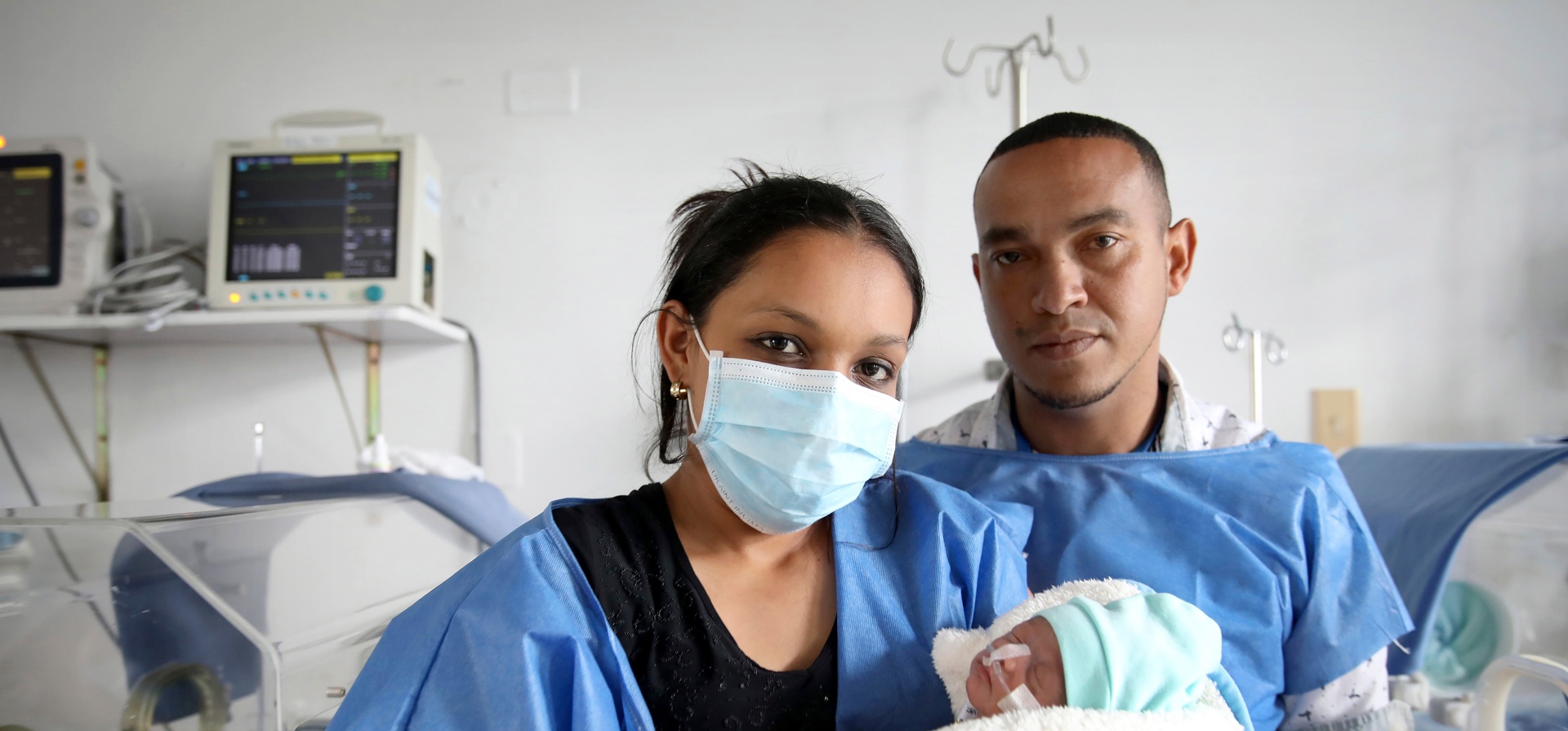Parents Yonielys Villegas and José Miguel Sequera Borges visit their newborn son Enmanuel at the main maternity hospital in Bogota, Colombia.