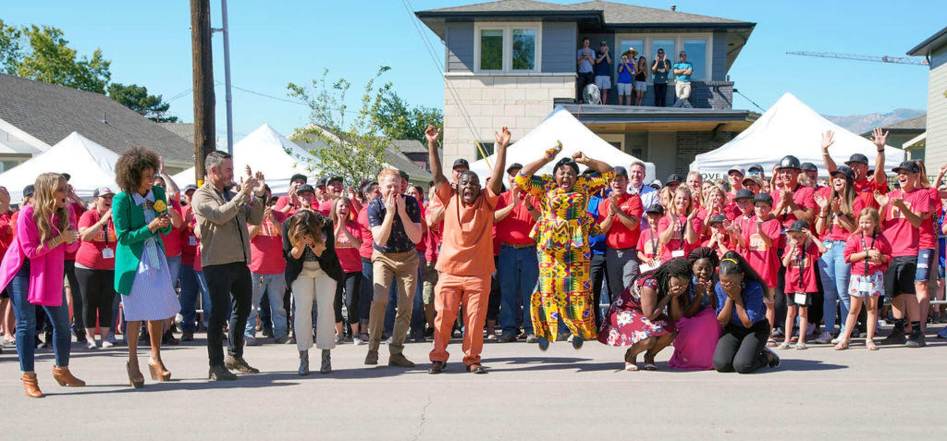 USA. Barobi Family sees their new home for the first time on the build site of Extreme Makeover: Home Edition.
