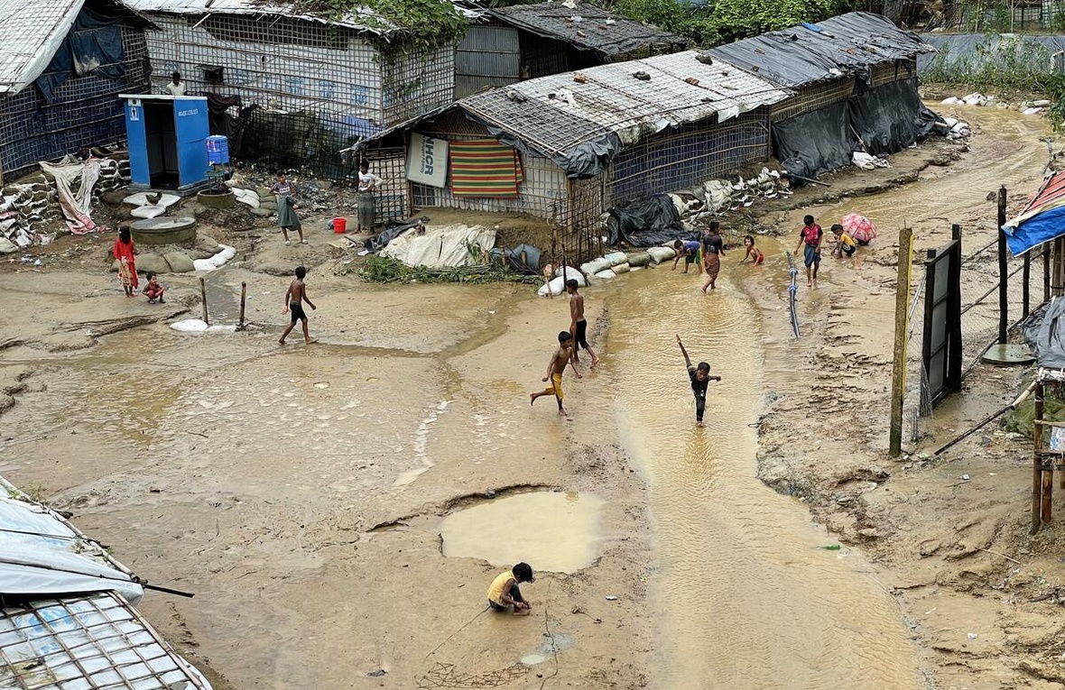 Rohingya refugee children play after heavy rain in Nayapara refugee camp in Cox's Bazar, Bangladesh.