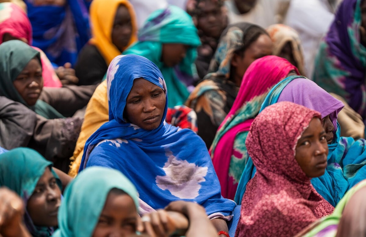 Sudanese refugees gather outside