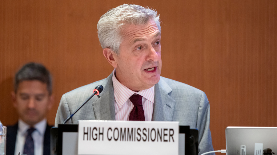 UN High Commissioner for Refugees Filippo Grandi speaks into a microphone during an event.