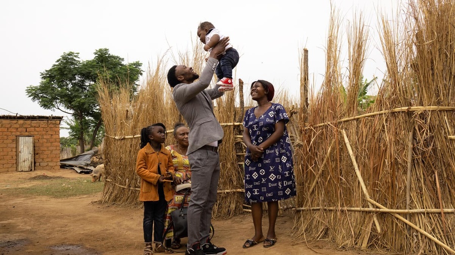 Zambia. Refugee family walks to church in Meheba settlement