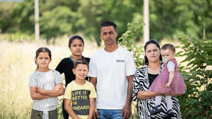A family of six pictured outdoors