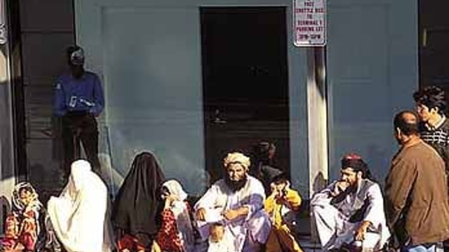 A newly arrived Afghan family at JFK airport, New York.