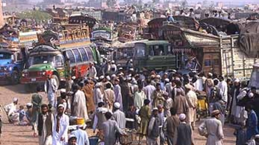Afghans prepare to return home at the Takhta Baig registration centre near Peshawar.