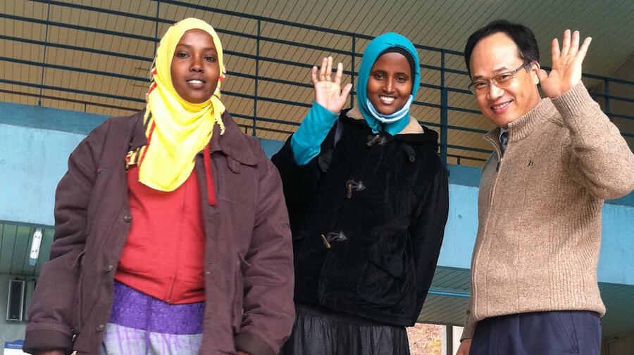 Nasra (left in yellow scarf) with fellow refugee Farah and a teacher at a language school in Iksan, South Korea.