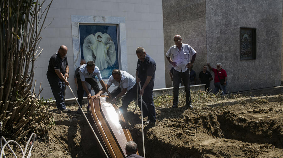 Italy. Burial of refugees.