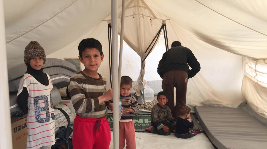 Iraq. Families continue to flee conflict in West Mosul, seeking shelter, safety