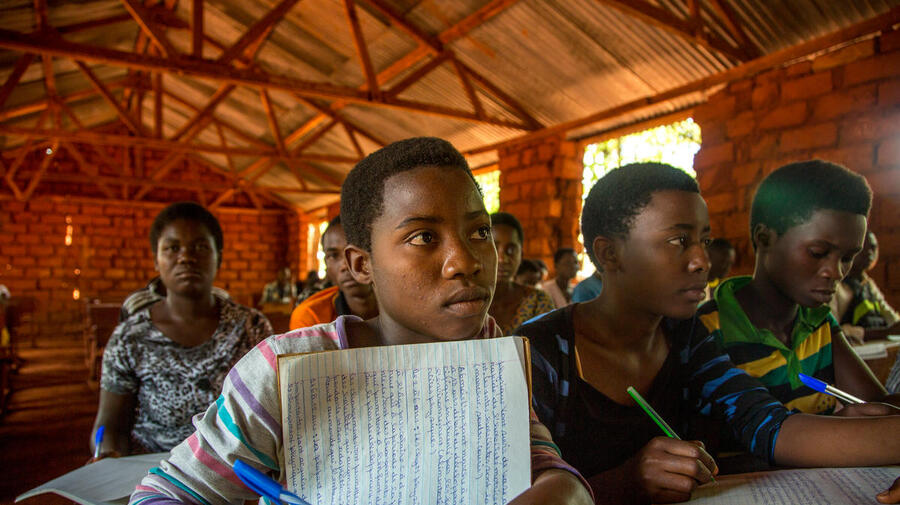 Tanzania. Refugee children battle the elements to learn