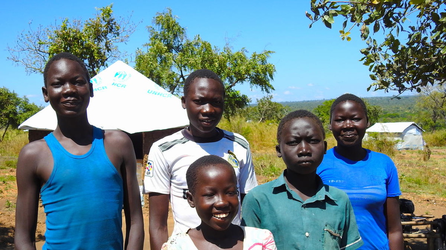 Uganda. South Sudanese refugee teenager takes care of younger siblings