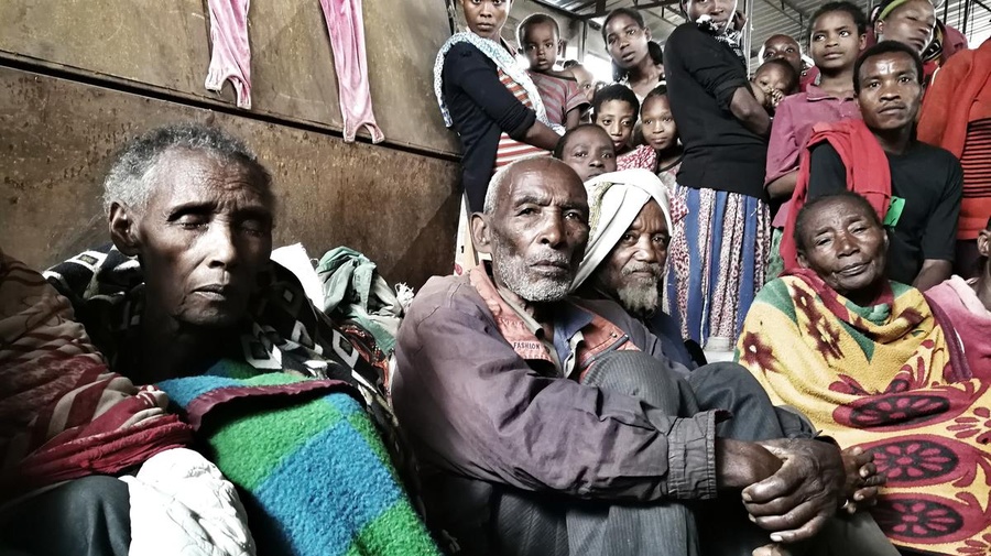 A group of people rest at the Yirga Chefe site for internally displaced people in Ethiopia.
