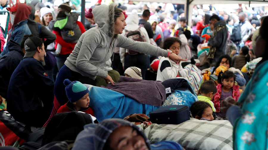 Colombia. Fleeing Venezuelans wait to register their exit from Colombia before entering into Ecuador, at the Rumichaca International Bridge.