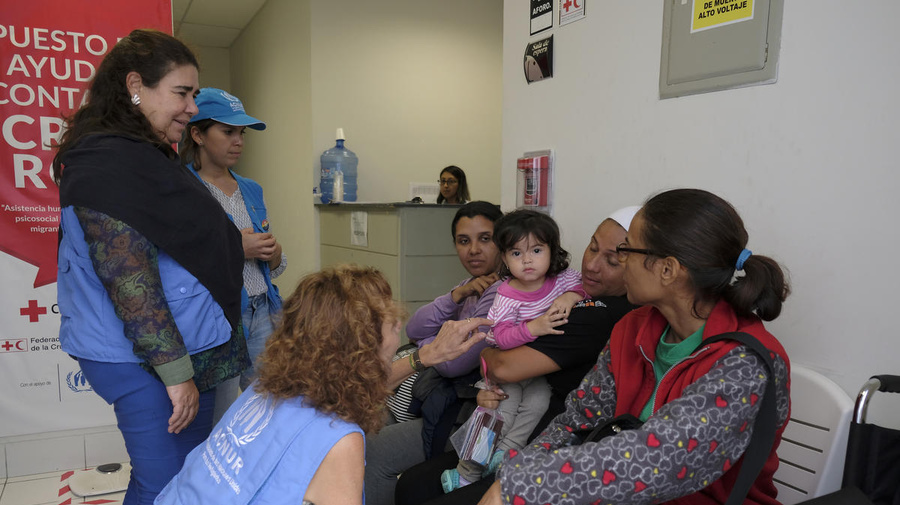 Peru. Venezuelan refugees and migrants arrive at the border point near Tumbes