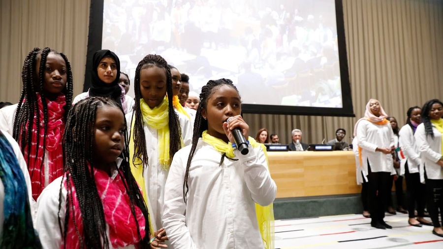 United States. The Global Compact on Refugees is approved by the UN General Assembly at the United Nations Headquarters in New York. The moment was commemorated with a special event including *senior* leaders from the UN, alongside refugees and a choir of young refugees and migrants.