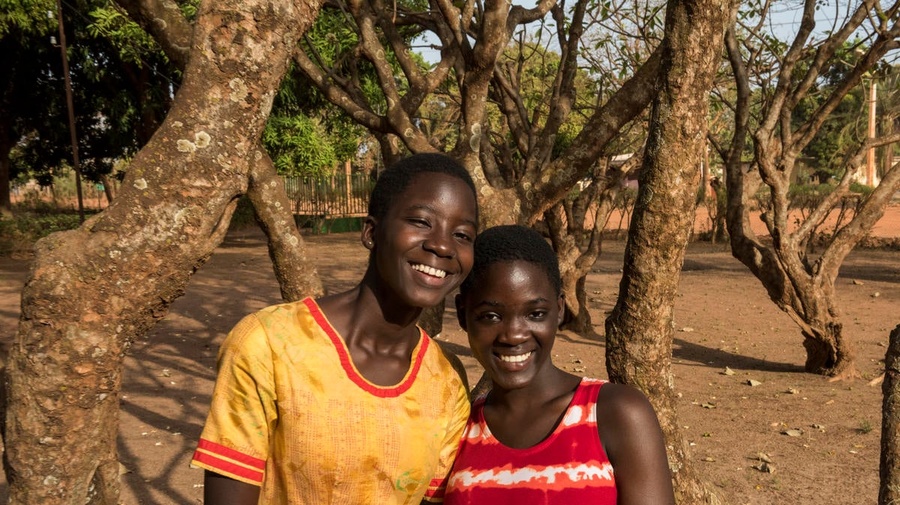 After growing up with no official nationality in an orphanage, now Françoise (left) and Christel are proud citizens of Cote d'Ivoire.