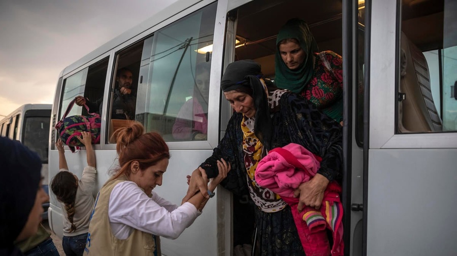 Iraq. Syrian refugees fleeing military campaign receive aid at UNHCR camp