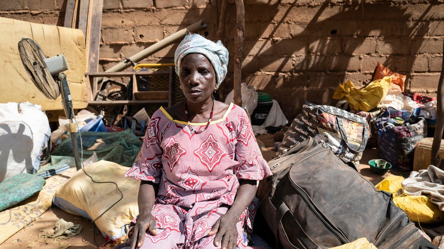 An internally displaced Burkinabe woman sits among belongings in Kaya, Burkina Faso, February 2020.