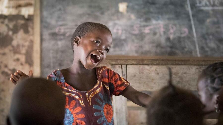 Six-year-old Gambolipai Martha leads the other children in a song during a pre-school class at Makpandu refugee settlement in South Sudan. Some 400 students, including local South Sudanese children and Congolese and Sudanese refugees, attend the school which was founded in 2019 by refugee community group, the Youth Association for Peace and Development. 