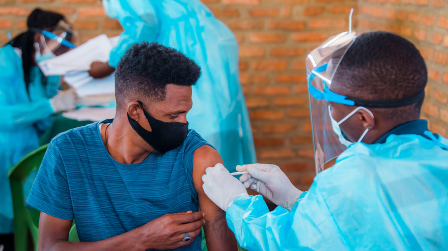 A refugee receives his COVID-19 vaccination at the Gashora Emergency Transit Mechanism centre in Rwanda.