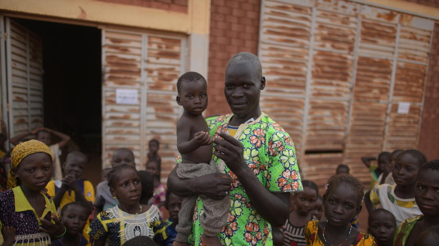 A father and his child at a centre for internally displaced families in Ouahigouya, Burkina Faso.