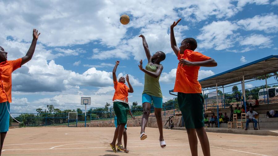 Young students play basketball as part of a Sports for Protection programme in Rwanda. 