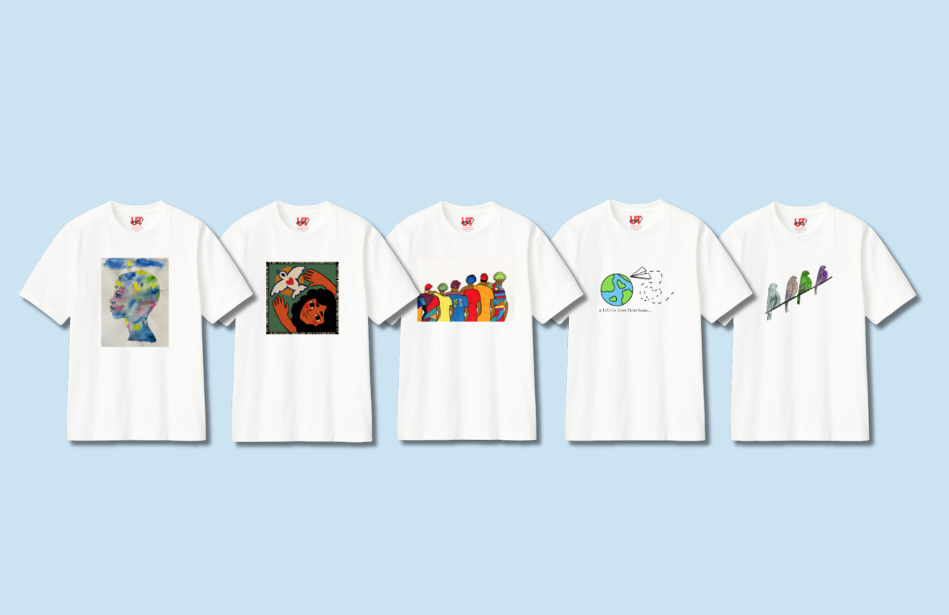 Five white t-shirts with unique artistic designs: one featuring a person painted with watercolors, another depicting a person with a dove, a third displaying a group of people, a fourth showcasing the Earth with a paper airplane, and the fifth has a design of four birds in a line.