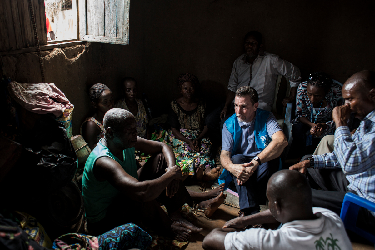 Democratic Republic of Congo. UNHCR's Special Advisor on Internal Displacement, Steven Corliss sits and talks with internally displaced persons