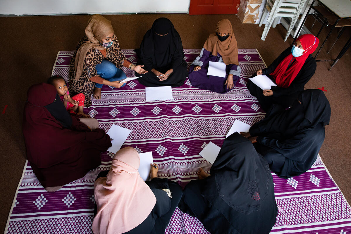 Malaysia. A refugee leader from Somalia facilitates a peer support group for Somali women refugees
