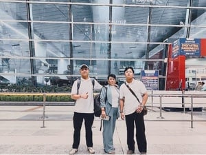 Soe San Dar in front of the Indira Gandhi International Terminal in Delhi, ready to embark on her new journey to Canada.