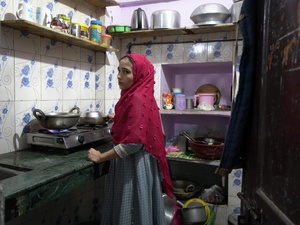 Amina Begum(name changed)  cooks a meal for her family in their small, rented home in Delhi. Rising LPG prices have forced refugee families to reduce cooking time and carefully ration every meal