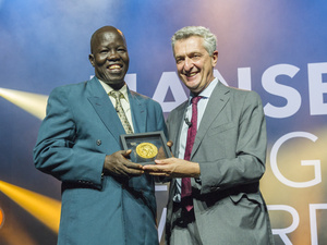 UN High Commissioner for Refugees, Filippo Grandi, presents the 2018 Nansen Refugee Award to Dr. Evan Atar Adaha, a surgeon and medical director at a hospital in north-eastern South Sudan.