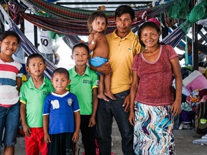 Euligio Baez, a Warao leader from Venezuela, poses with his family in Boa Vista, Brazil