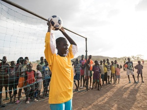 Kenya. Margaret Monday Dominic, 15 plays football with her friends and classmates