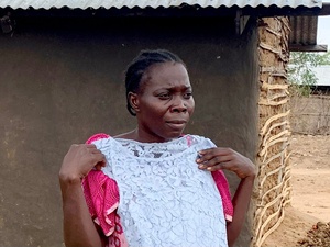 South Sudan. Clementina and her family receive new clothes