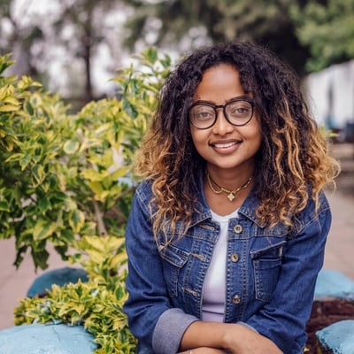 Mielena, a young woman, smiles at the camera