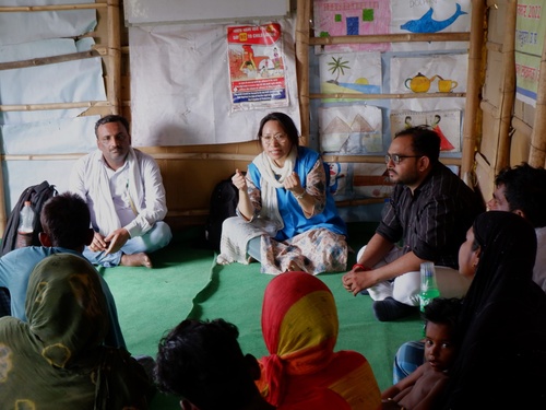 UNHCR India staff in community meetings 