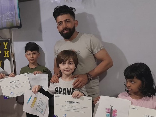 Refugee teaching children