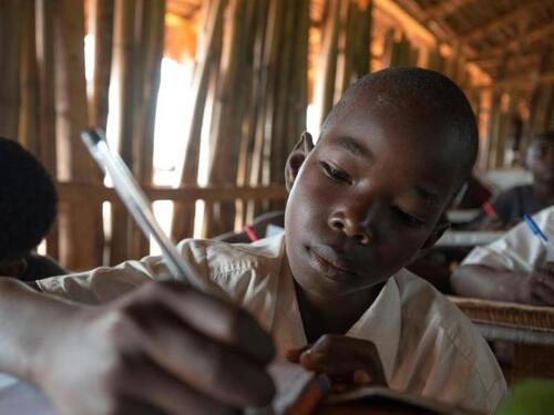Kenya. Students using tablets in Nasib secondary school