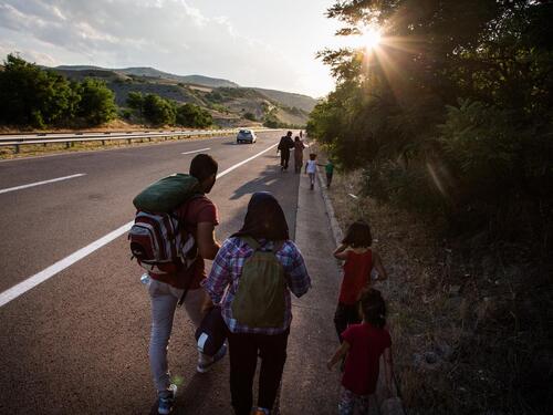 Macedonia. Syrian refugees walk main highway