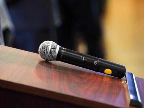 A microphone on a small podest. 